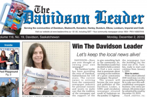 The front page of the Davidson Herald paper. Under the title of the paper is a photo of Tara de Ryk on the left, holding two papers. On the right is an article called "Win The Davidson Herald!" with the subhead "Let's keep local journalism alive."